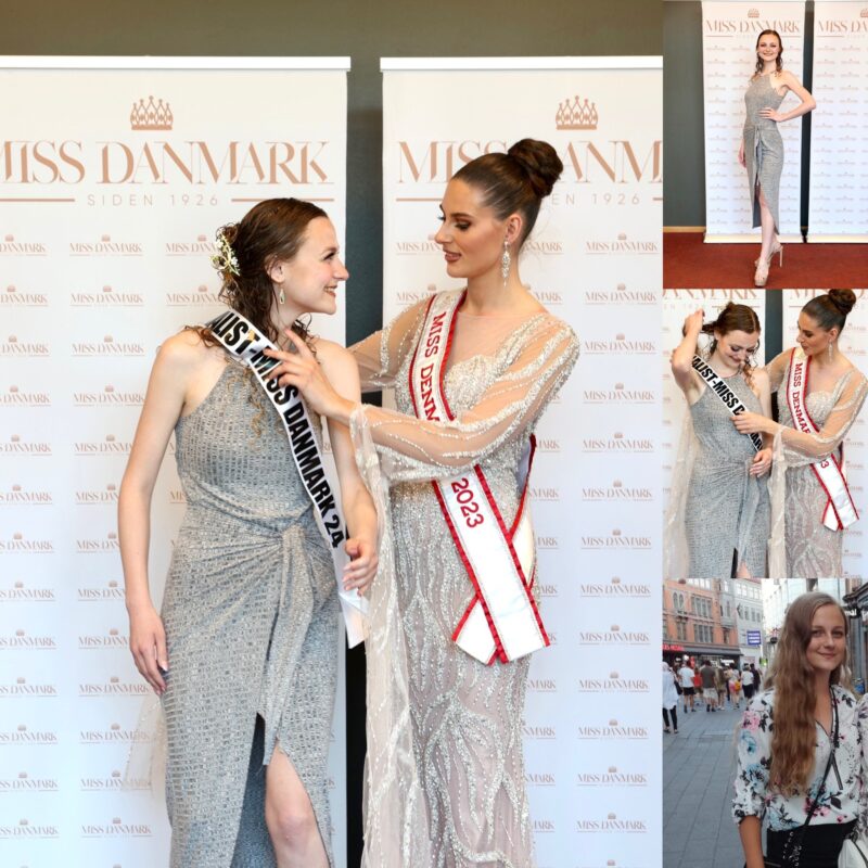 Participant has Miss Danmark sash placed over her shoulder in front of the press wall